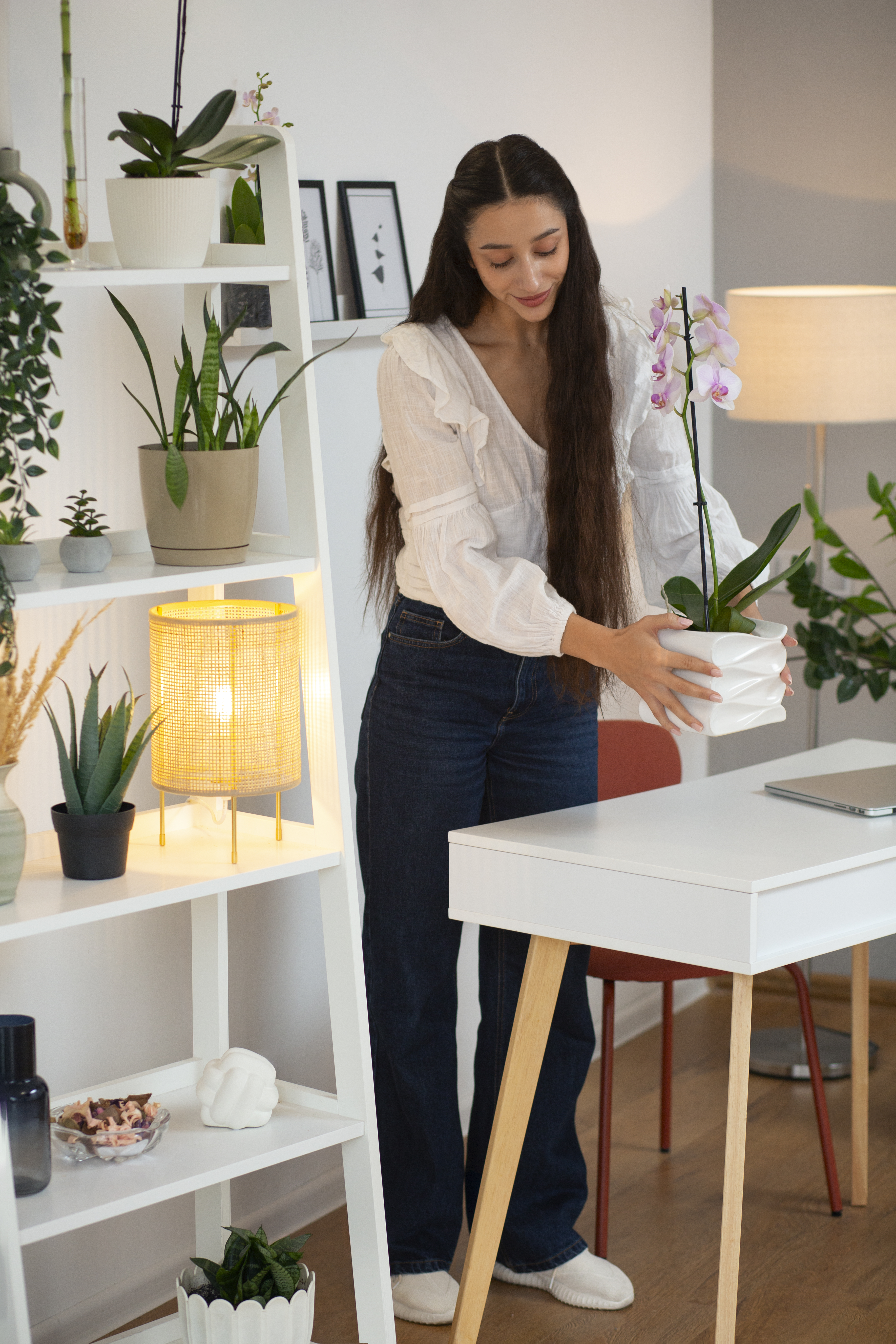 woman-decorating-her-home-with-orchid-flower
